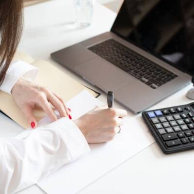 accountant-at-work-writing-signing-documents-2022-11-12-11-33-31-utc